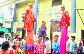 Rajasthani artistes perform on the streets of Dehradun.