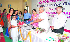 Vidhan Sabha Speaker Harbans Kapoor distributes kits to students in Dehradun on Saturday.