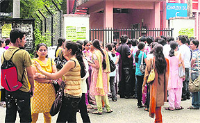 MCA (semester II) students protest outside the Examination Block of Jammu University after boycotting examination on Saturday.