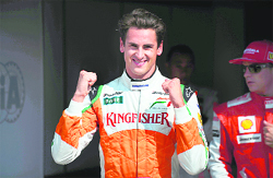 Force Indias Adrian Sutil celebrates finishing second after the qualifying session of the Italian Grand Prix.