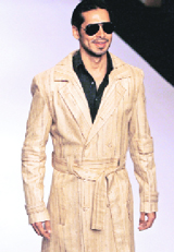 Bollywood actor Dino Morea presents a creation by Samant Chauhan during the Van Heusen India Men's Fashion Week in New Delhi on Sunday.