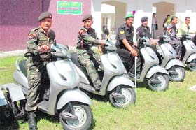 Physically challenged Army men with new scooters provided by the Army at RIMC, Dehradun