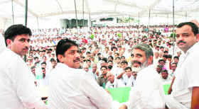 INLD leader and Rajya Sabha member Ajay Chautala addresses his first election meeting after the distribution of the ticket for the Assembly poll at Meham Chaubisi on Sunday. On his right is party candidate from Meham Balbir Singh.