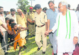 Bihar Chief Minister Nitish Kumar attends a rally on the last day of campaigning for the second phase of the byelections in the state, at Bagha in Champaran on Sunday.  PTI