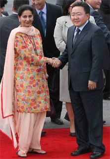 Mongolian President Tsakhiagiin Elbegdorj with Minister of State for External Affairs Preneet Kaur on his arrival at the Air Force Station, Palam, New Delhi, on Sunday.  PTI