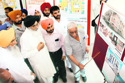 Punjab Chief Minister Parkash Singh Badal views a map after inaugurating the development office building in Mohali on Sunday. 