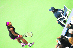Serena Williams argues a call by the line judge, leading to her disqualification for a conduct violation during her semifinal against Kim Clijsters on Sunday. Clijsters won 6-4, 7-5. 