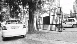A security gate leaves ample space for vehicles to pass at Phase VII in Mohali.