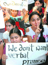 Girls sit on a dharna at the Chandigarh College of Engineering and Technology (CCET), Sector 26, on Monday. 