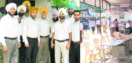 Members of the District Bar Association protest at district court complex, Fatehgarh Sahib, on Monday. A Tribune photograph (right) Empty chairs at Mohali district courts after lawyers went on strike against hike in court fee on Monday. 