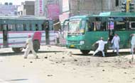 A view of the buses damaged in transporter - lawyer clash in Bathinda 