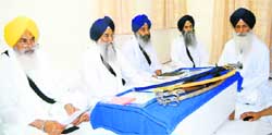 The Sikh high priests discuss the Kurukshetra gurdwara incident in Amritsar on Monday. Akal Takht Jathedar Gurbachan Singh is second from left