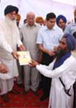 CM Parkash Singh Badal handing over the letter of possession in Muktsar 