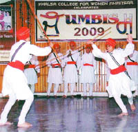 Girls of the Khalsa College of Women perform gatka during a college function in Amritsar. 