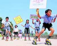 Schoolchildren raise awareness on skates in Chandigarh on Tuesday.