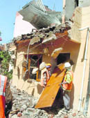 CHB staff remove encroachment in Sector 44, Chandigarh, on Tuesday.