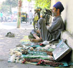 A gemstone seller outside Doon Hospital in Dehradun.