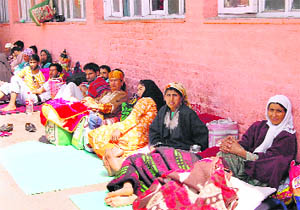 Patients wait outside Lalla Ded Hospital where strike by doctors has affected the services.