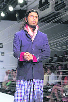 MFW:Scarves are hot in men's accessories for this winter, as showcased in this Rajesh Pratap Singh attire at Men's Fashion Week