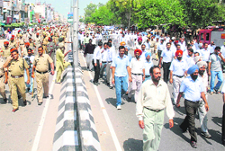 Lawyers hold a march in front of the bus stand in Bathinda on Tuesday.