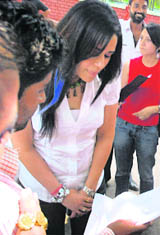 Actress Mona Singh being shown the summons by a human rights activist and his supporters in Chandigarh on Wednesday.
