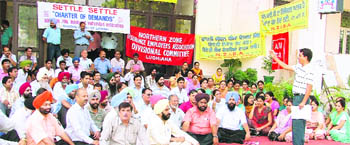 Employees of the LIC stage a dharna in Ludhiana on Wednesday.