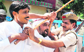 Samajwadi Party supporters clash with cops during a protest in Allahabad on Wednesday. 