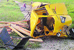 The wreckage of the tempo which was hit by a train at a level crossing near Kasu Begu village, near Ferozepur, on Wednesday. 