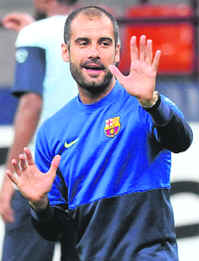 Barcelona coach Josep Guardiola guides training a day before the Champions League soccer match against Inter Milan at San Siro stadium in Milan on Tuesday.  Reuters