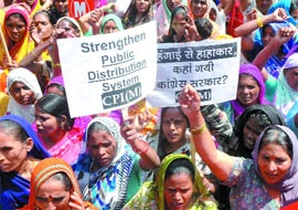 Activists of the CPM shout slogans against against price rise at a protest held near the Delhi Secretariat in New Delhi on Thurday.