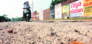 A dilapidated Ambala road after the recent incessant rain.