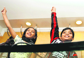 Child actors Rubina Ali and Azharuddin sing Jai Ho during a press conference in Kochi on Thursday. They are in the city to participate in a film festival. 
