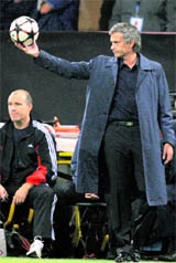 Inter Milans coach Jose Mourinho gestures during their Champions League soccer match against Barcelona at San Siro stadium in Milan on Thursday.