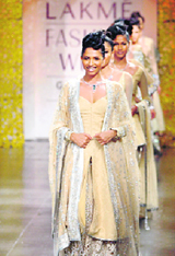 Models present creations by Neeta Lulla on the first day of Lakme India Fashion Week in Mumbai on Friday.