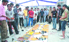 Students of the Dr B.R. Ambedkar National Institute of Technology watch a model at TechNITi09 in Jalandhar on Friday.