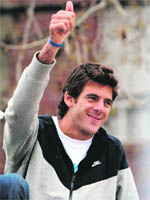 US Open champion Juan Martin del Potro gestures to supporters as he arrives on a fire truck at his hometown of Tandil, on Friday.