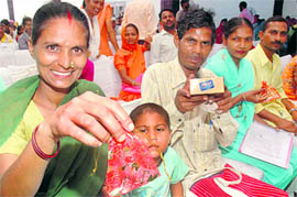Beneficiaries with keys to their flats in Sector 38 (West), Chandigarh, on Saturday. 