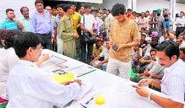 Litigants wait for their turn during a lok adalat at the district courts in Chandigarh on Saturday.