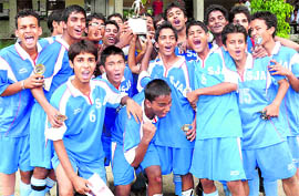 St Joseph Academy football team with the trophy of the Dehradun Council School Football tournament.