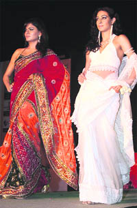 Models walk the ramp during a fashion show in Gurgaon on Friday.