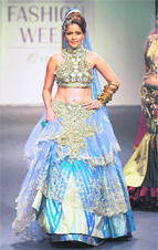 Models showcase creations by designer Ritu Beri