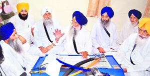 Sikh high priests discuss the Kurukshetra gurdwara row at Akal Takht in Amritsar on Saturday. 