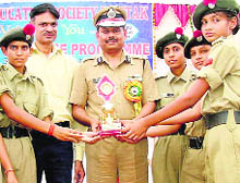 Rohtak IGP V Kamaraja awards students of Sainik School during a career guidance programme in Rohtak on Saturday. 