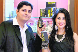 K Ramana (L), manager (sales & marketing) of Paul Smith, with brand manager Sonal Bhatia during the launch of Man Fragrance by the company, in Bangalore on Saturday.
