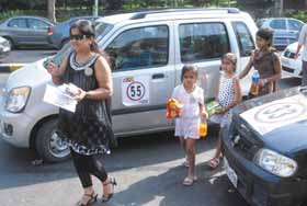 A mother-daughter pair participates in the 9th Family Fun Car Rally in 