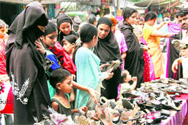 Muslim women shop for Eid-ul-Fitr in Dehradun on Sunday.