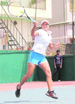A tennis player in action at the venue of the ITF Womens Tennis tournament