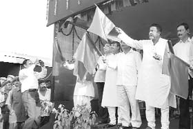 Union Minister of State for Shipping Mukul Roy (second from right) flags off the new Agartala-Dharmanagar passenger train at Agartala railway station on Sunday.