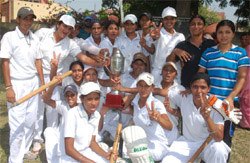 Girls of Shaheed Kanshi Ram College of Physical Education, Bhagomajra, flash victory signs after lifting the Punjabi University inter-college cricket championship trophy in Bathinda 