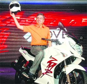 Pawan Munjal, MD, Hero Honda Motors, poses with Next Generation Karizma ZMR at its launch in Gurgaon on Monday. The ZMR, priced at Rs 91,000 (ex-showroom), is powered by a 225 cc engine.
